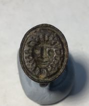 Post medieval copper alloy seal matrix with a conical openwork handle with four apertures. Seal