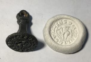 Medieval “chess piece” circular style bronze seal matrix, hexagonally facetted trefoil terminal.