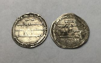 Two medieval Islamic Silver Dirham coins.