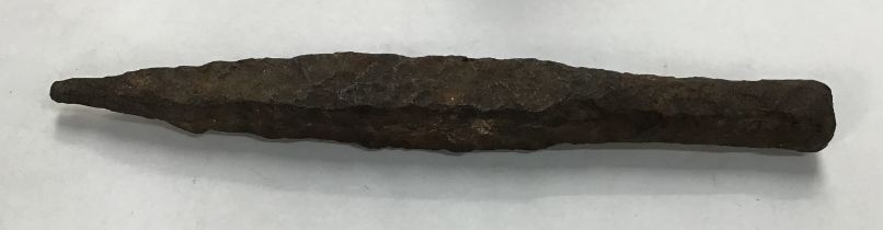 Possibly a Medieval solid iron spike for working with metal or stone . No collar for a shaft so