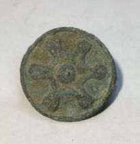 A 1st - 2nd century A.D. Roman Disc Brooch. Cast in bronze this brooch is of disc type and
