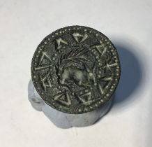 Medieval copper alloy seal matrix, hexagonally faceted handle with a pierced terminal. Circular,Seal