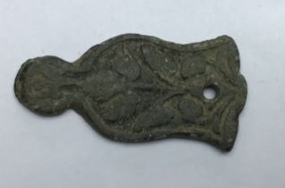 Mid 16th - mid 17th century.Post-medieval copper alloy mount with one rivet hole and a symmetrical