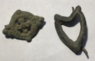 Mixed lot of two 17th century. Post-medieval copper alloy harness mounts. First is heart-shaped with