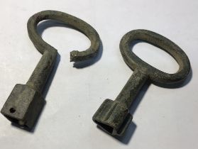 Pair of copper alloy post medieval barrel tap keys.