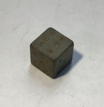 Post-medieval copper alloy die in very fresh condition, a cube (9.5 x 9.5 x 9.5mm) with blind-