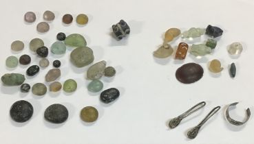 Collection of Ancient Greek and Roman Glass Beads with silver earrings and ring and glass gaming