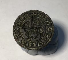 Medieval copper alloy seal matrix, hexagonally faceted handle with a pierced terminal. Circular,Seal