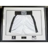 Muhammad Ali: A framed and glazed pair of Everlast boxing shorts, signed by Muhammad Ali to lower