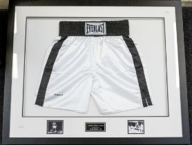 Muhammad Ali: A framed and glazed pair of Everlast boxing shorts, signed by Muhammad Ali to lower