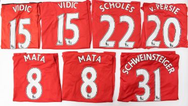 Manchester United: A collection of seven Manchester United, home short-sleeved football shirts, to