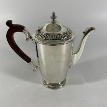 A Mappin and Webb silver coffee pot Sheffield 1956/57, approx 420grams, approx 18cm tall. Some