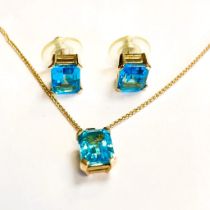 Topaz and 9ct yellow gold earrings and pendant. Emerald cut sky blue topaz stud earrings in 9ct