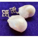 *******AWAY TO VENDOR***** A pair of "fireball" pearl earrings. Featuring freeform fireball