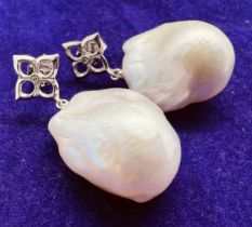 *******AWAY TO VENDOR***** A pair of "fireball" pearl earrings. Featuring freeform fireball