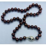 ******AWAY TO VENDOR****** Stylised "coffee bean" clasped Princess length brown cultured pearl