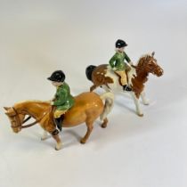 2 Beswick girl and boy figures on ponies both good condition.