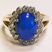 Electric blue cabochon opal and diamond 18ct yellow gold ring. 18ct yellow gold opal cluster ring