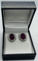 ******AWAY TO VENDOR*****A substantial pair of ruby and diamond earrings. Featuring a pair of oval