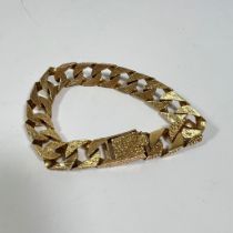A hallmarked 9ct yellow gold bracelet with textured and plain finish approximately 57.5grams