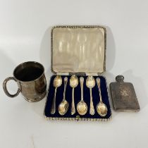 A boxed set of six silver golfing spoons and a silver tankard 7.5cm tall (no engraving) and a silver