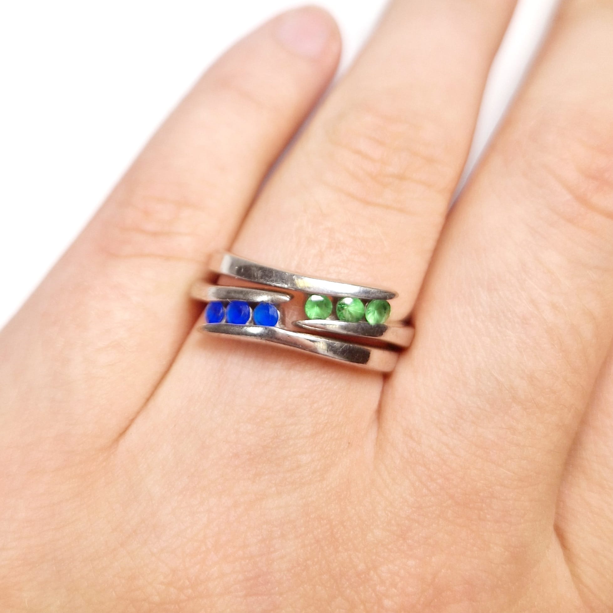 Four rings to include: Two silver metal rings (one set with 3 emeralds, one set with sapphire - Image 3 of 3