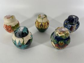 Five Moorcroft lidded ginger jars. Approximately 11cm tall. All in good condition. Some crazing