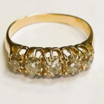 Victorian style diamond 18ct yellow gold ring. Five oval cut diamonds with a tint Approximately 0.