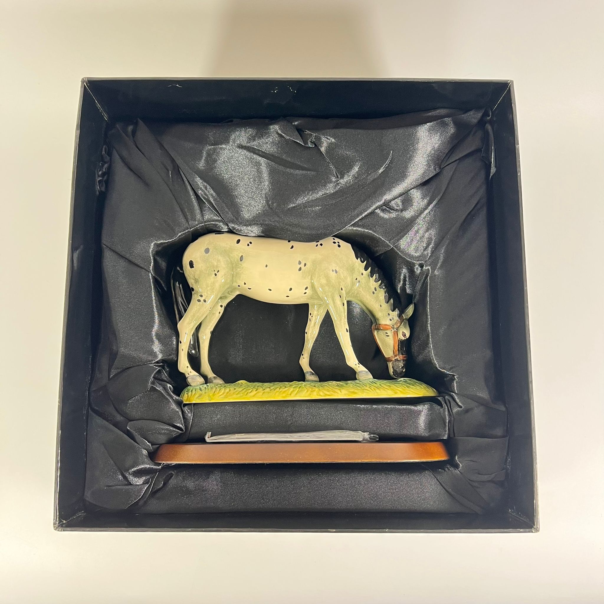 A boxed Royal Doulton Appaloose Horse boxed with stand.