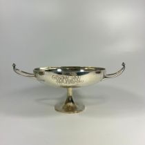 A silver twin handle trophy dish London 1908 Finnigans Ltd. Approx 12cm tall & 32cm wide. Approx