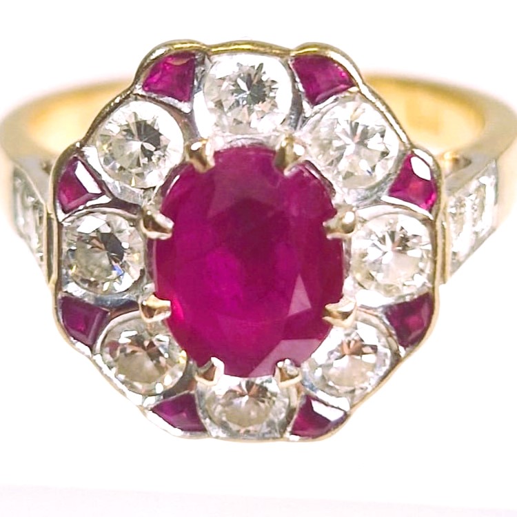 An 18ct hallmarked yellow gold diamond and filled ruby ring. Main ruby approximately 1.35cts, 8 - Image 2 of 2