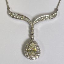 *******AWAY TO VENDOR***** An impressive diamond drop pendant necklace, the pear shaped diamond