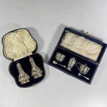 Two boxed silver cruet sets, total weighable silver approx 118grams, both sets generally good.