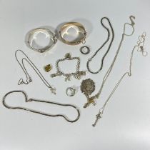 Collection of silver jewellery to include a buckle bangle, fob, ring, various chains etc. Approx