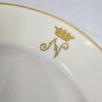 A matched 19th Century part dinner service (20 pieces) with a gilt "N" under a crown crest.