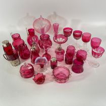 28 pieces of cranberry glass including a silver glass golder, 2 silver top bottles and a jug.