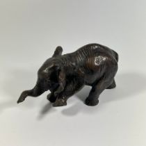 A bronze figure of a young Elephant, approx 17cm long with good patina.