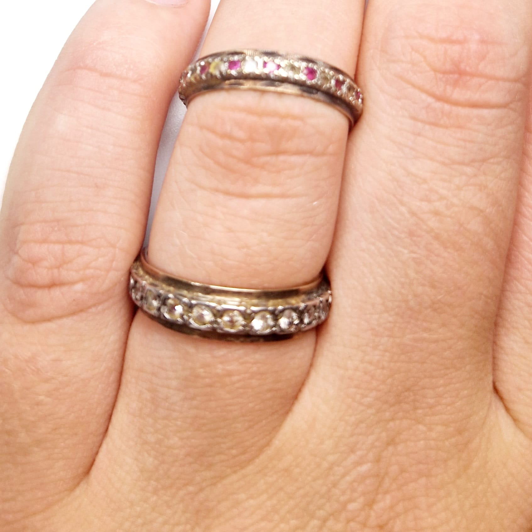 Four rings to include: Two silver metal rings (one set with 3 emeralds, one set with sapphire - Image 2 of 3