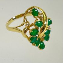 An 18ct yellow gold 750 emerald and diamond cluster ring. Size L. Approximately 5.3 grams