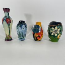 Four Moorcroft vases. Tallest approximately 21cm.  All in good condition.  Some crazing and 2