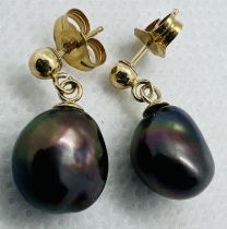 ********AWAY TO VENDOR******** A pair of black cultured pearl drop earrings. Featuring two baroque