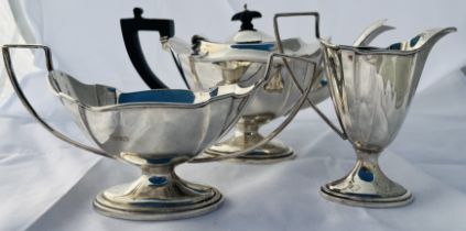 A bachelors sterling silver tea set. Featuring tea pot, milk and sugar. Marked for Gibson & Co,