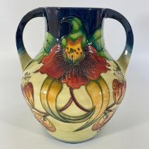 A large Moorcroft Anna Lily turn handle vase. Approximately 26cm tall. c98. Some crazing but