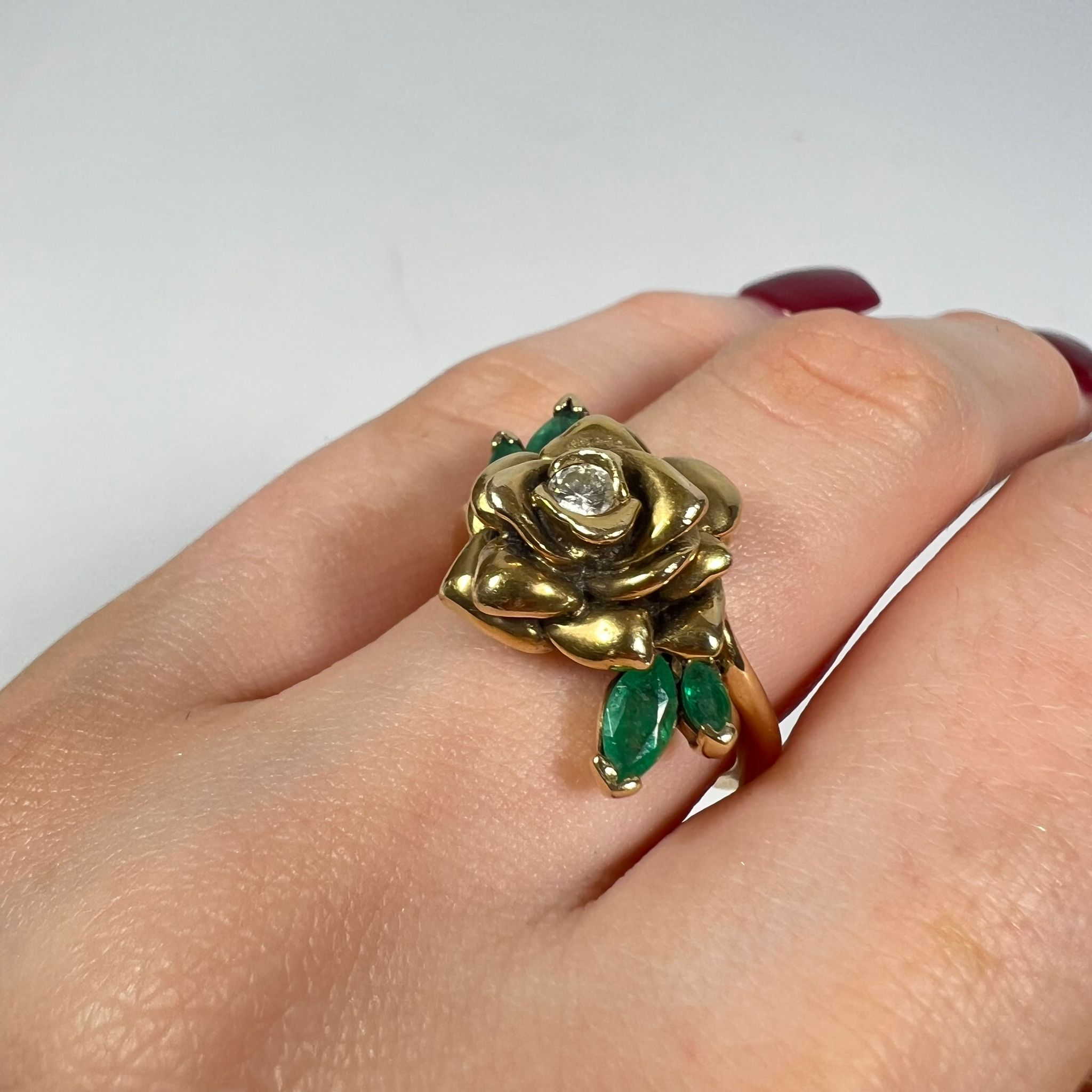 A 14ct yellow gold flowering rose diamond and emerald ring. Size L. Approximately 8.6 grams - Image 2 of 3