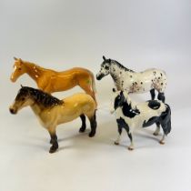 Four Beswick Horses, Appaloosa Stallion, a Pinto Pony, Palamino and Highland Pony - all good