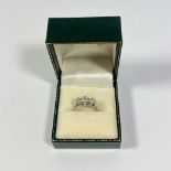 ****REOFFER JANUARY 12 2024, ESTIMATE £600-800***** An 18ct white gold 3 stone diamond ring, size M.