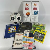 An Espana '82 signed football by members of the England Football team along with a cushion seat,