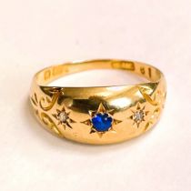 Engraved 18ct gold band with sapphire like stone and two diamonds. Size M. Approximately 2.3 grams