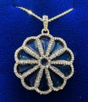 ****AWAY TO VENDOR***** A gilded enamel and diamond flower pendant, set with 1.25 carats (estimated)