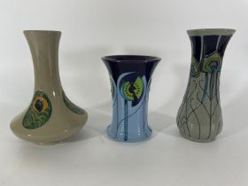 Three Moorcroft stylised  vases. Approximately 21and 16cm tall. All in good condition. 2 seconds